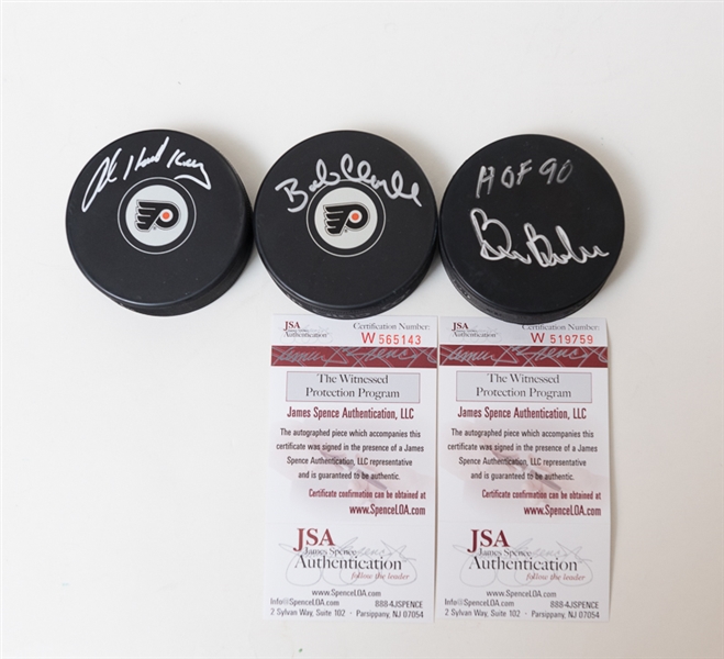 Trio of Philadelphia Flyers Greats Signed Hockey Pucks - Bob Clarke, Bill Barber & Bob Kelly - JSA