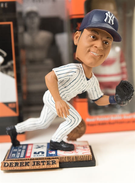 Lot of (9) Baseball Bobble Heads, Figures, & Stein (Inc. Babe Ruth & Derek Jeter) and a Reggie Jackson Signed Baseball Card (UDA)