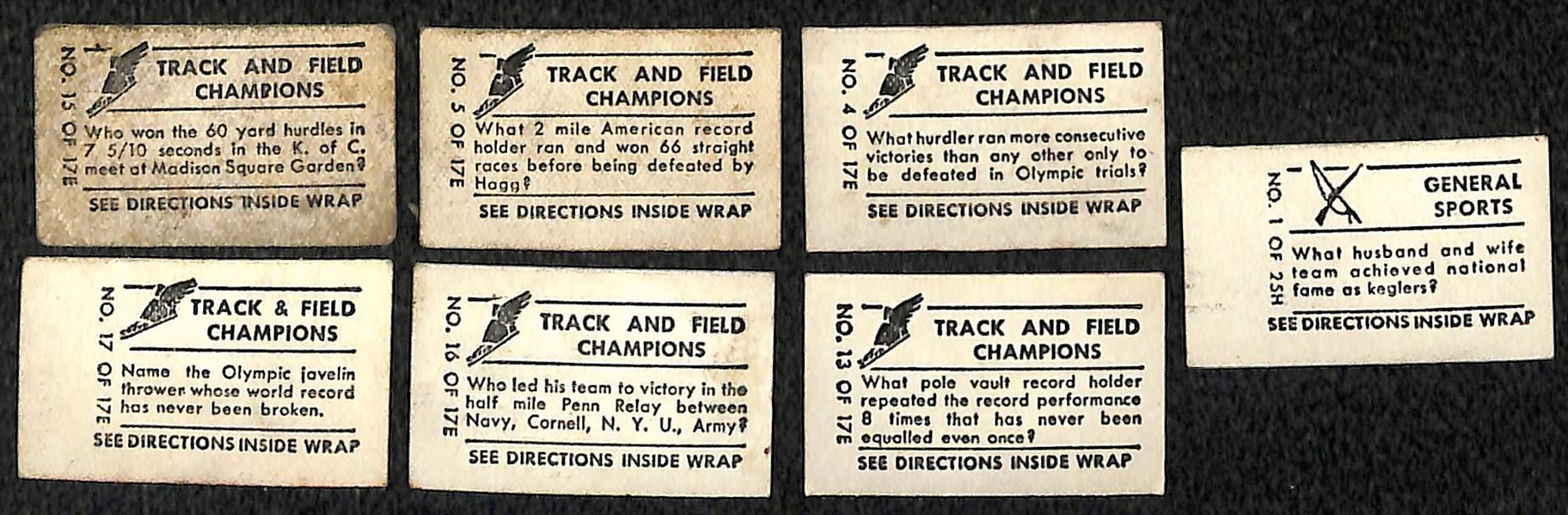 Lot of (7) 1948 Topps Magic Cards - (6) Track & Field and (1) Remington