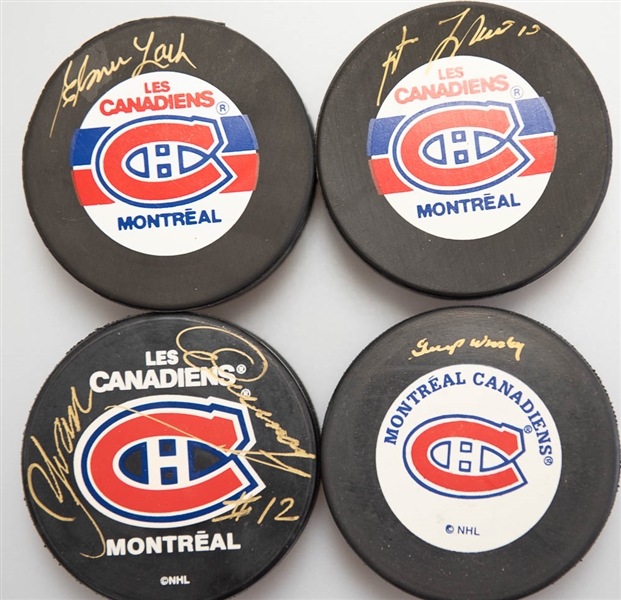 Lot of (4) Signed Montreal Canadiens Hockey Pucks (Guy Lafleur, Gump Worsley, Yvan Cournoyer, Elmer Lach)  - JSA Auction Letter