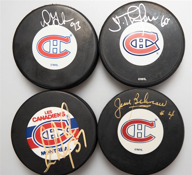 Lot of (4) Signed Montreal Canadiens Hockey Pucks (Jean Beliveau, Eric Desjardins, Doug Gilmer, Jose Theodore)  - JSA Auction Letter