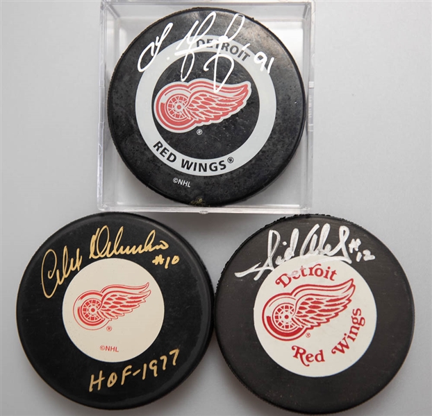 Lot of (3) Signed Detroit Red Wings Hockey Pucks (Alex Delvecchio, Sergei Fedorov, Sid Abel)  - JSA Auction Letter