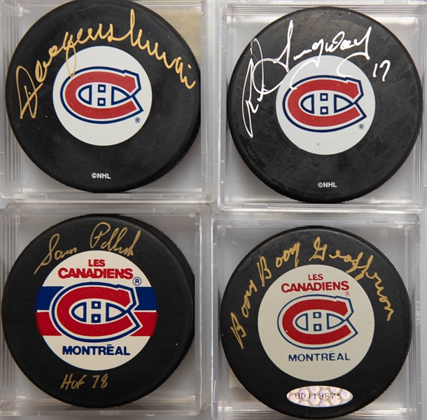 Lot of (4) Signed Montreal Canadiens Hockey Pucks (Jacques Lemaire, Rod Langway, Boom Boom Geoffrion, Sam Pollock)  - JSA Auction Letter