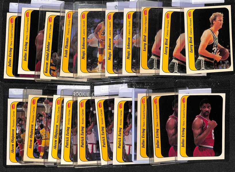 Lot of (20) 1986-87 Fleer Basketball Stickers w. M. Johnson, Bird, Jabbar, Erving, Olajuwon, Ewing, Thomas