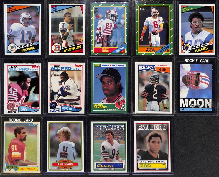 Lot of (14) 1980s Football Star Rookie Cards Feat. Marino, Elway, Rice, Taylor, Dickerson, D. Sanders, and More