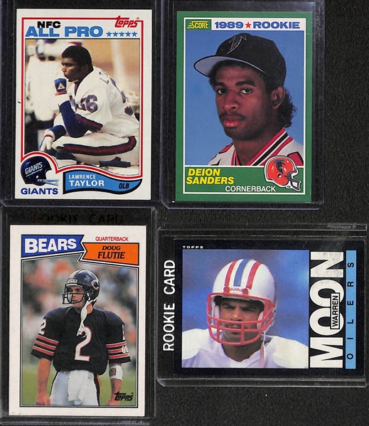 Lot of (14) 1980s Football Star Rookie Cards Feat. Marino, Elway, Rice, Taylor, Dickerson, D. Sanders, and More
