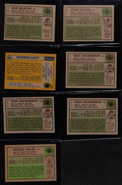 Lot of (7) 1980s Topps Football Rookies w. Marino, Elway, Lott, Dickerson and Craig