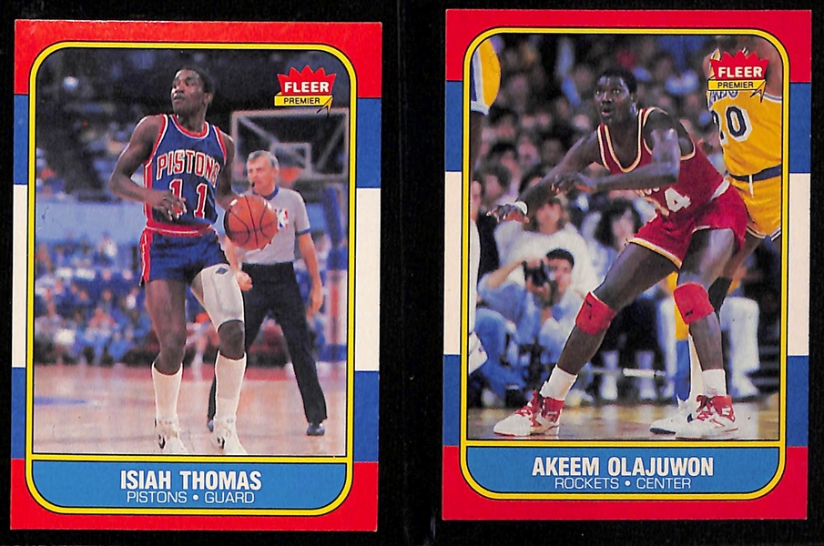 Lot of (8) 1986-87 Fleer Basketball Cards w. Charles Barkley, Isiah Thomas, Akeem Olajuwon, and Others
