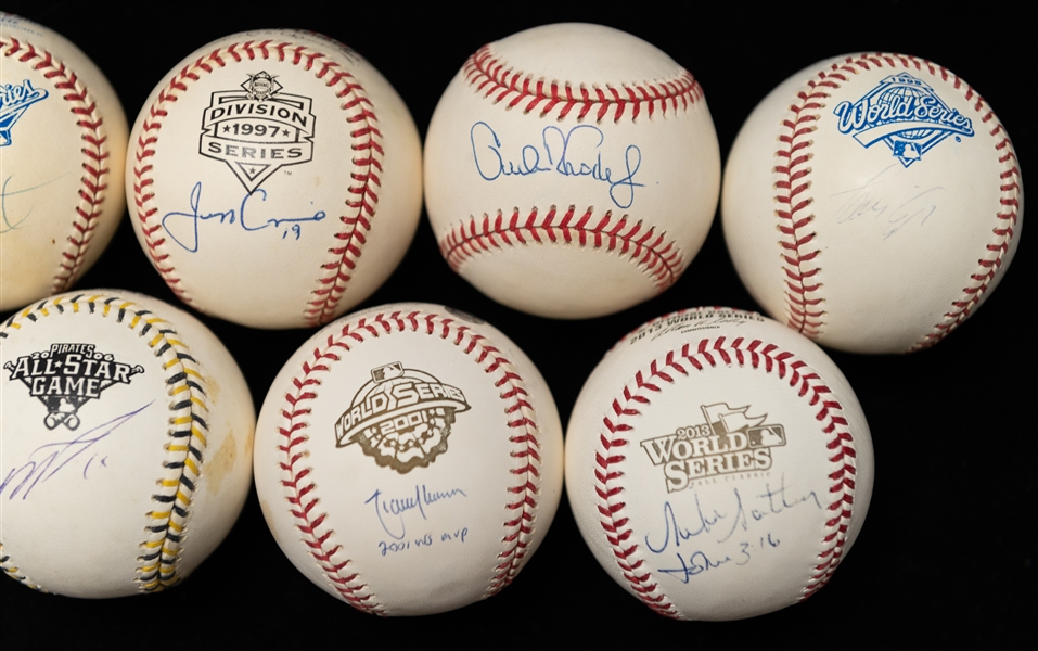 Lot (8) Autographed Mostly Official World Series Baseballs w. Randy Johnson, Jeff Conine and Others (JSA Auction Letter)