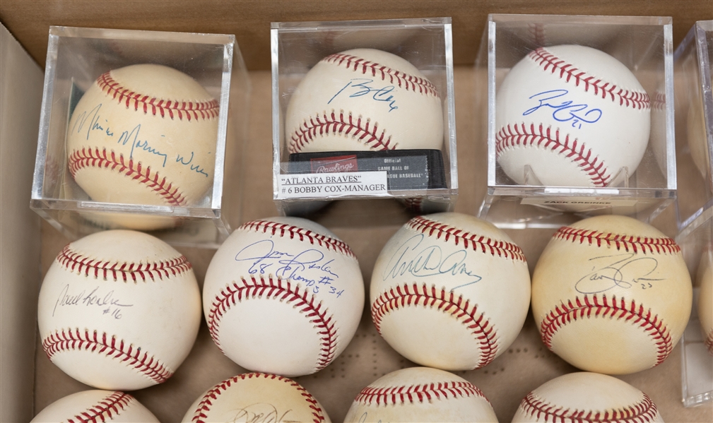 Lot of (21) Autographed Baseballs w. Arthur Ashe, Manny Ramirez, Maury Wills, Zack Greinke, Bobby Cox, and Others (JSA Auction Letter)
