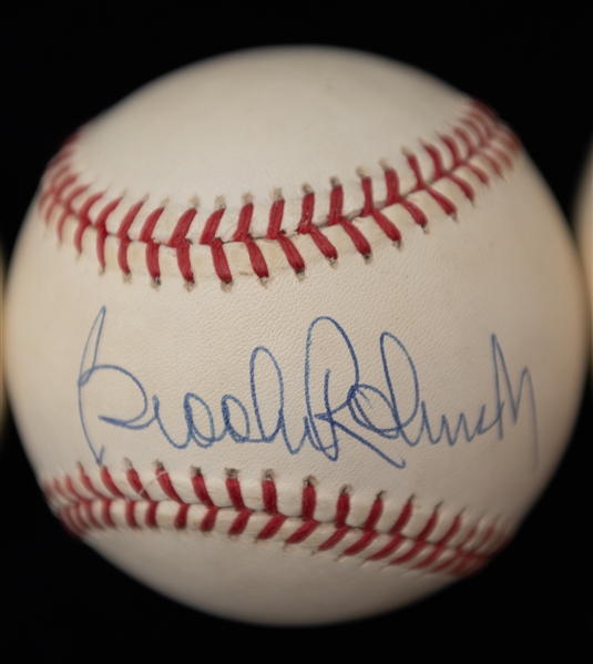 Lot of (4) Autographed Baseballs w. Willie McCovey, Brooks Robinson, Bill Scowron, and Dave Duncan (JSA and PSA Cert)