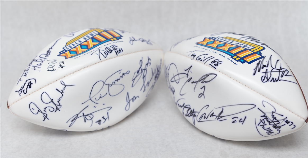Lot of (2) Autographed Super Bowl 33 Footballs w. Over 25 Signatures Inc. Strahan, Munoz, Esiason, Simms, Landry, and Others (JSA Auction Letter)
