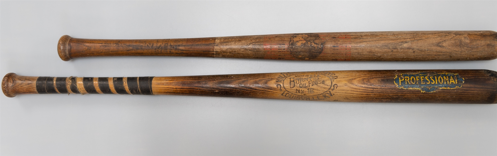 Lot of (2) Vintage Baseball Bats w. a Hillerich & Bradsby Co. Burnt Oil Finish 35 Decal Bat Circa 1920s
