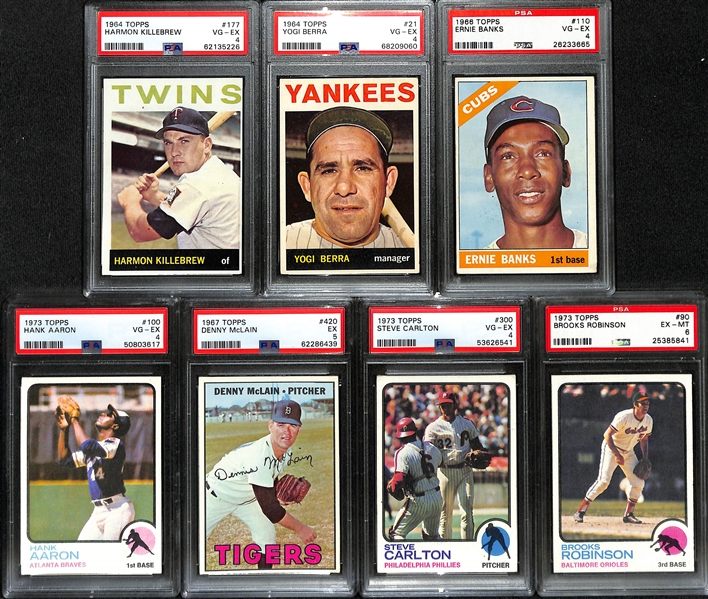 (7) PSA Graded 1960s and 1970s Topps Baseball Hall of Fame and Stars- 1964 Harmon Killebrew (PSA 4), 1964 Yogi Berra (PSA 4), 1966 Ernie Banks (PSA 4), 1973 Hank Aaron (PSA 4), +