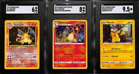 Lot of (3) SGC Graded Pokemon Cards Inc. 1999 Base #4 Charizard Holographic (Graded 6), 2020 Vivid Voltage #025 Charizard Cracked Ice Holographic (Graded 8), 2022 Promo Pikachu Pokemon Go Tin...