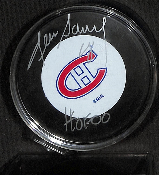 Lot of (4)  Signed Hockey Pucks- Denis Savard (HOF), Boom Boom Bernie Geoffrion (HOF), Guy Lapointe (HOF), Mike Eruzione (JSA COA) - JSA Auction Letter