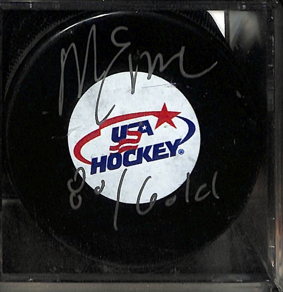 Lot of (4)  Signed Hockey Pucks- Denis Savard (HOF), Boom Boom Bernie Geoffrion (HOF), Guy Lapointe (HOF), Mike Eruzione (JSA COA) - JSA Auction Letter