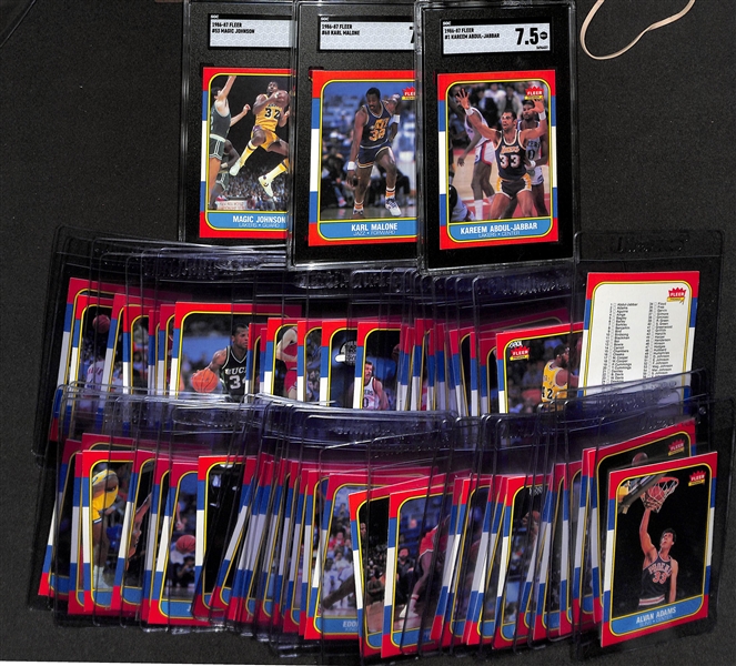 Lot of (66) 1986-87 Fleer Basketball Cards (66 different cards) w.  3 Graded Cards (Magic Johnson SGC 8, Karl Malone SGC 7, Kareem Abdul-Jabaar SGC  7.5)