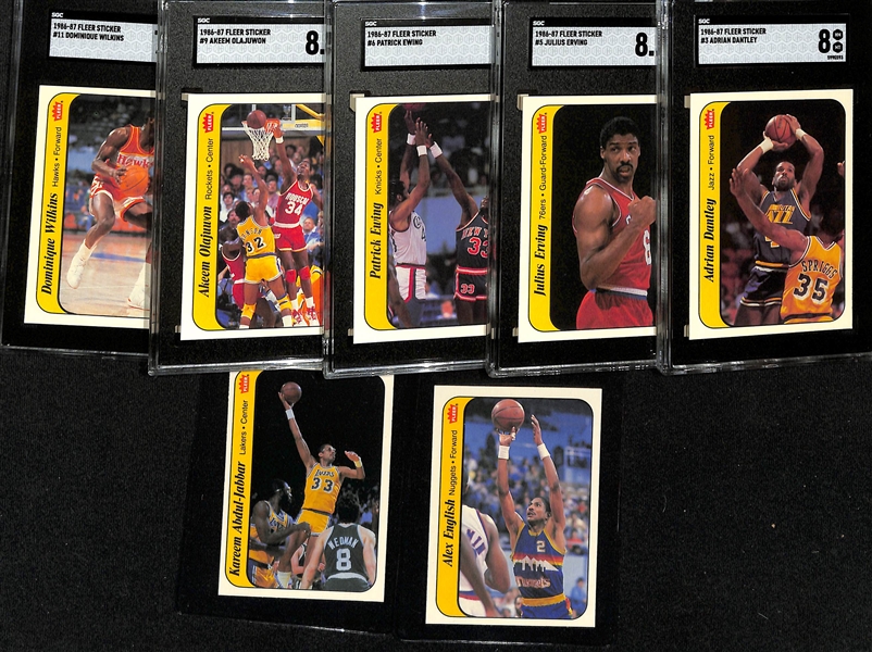 1986-87 Fleer Basketball Partial Sticker Set (7 of 11 stickers) inc. 5 Graded (Adrian Dantley SGC 8, Julius Erving SGC 8.5, Patrick Ewing SGC 7, Dominique Wilkins SGC 7.5, Akeem Olajuwon SGC 8.5) -...