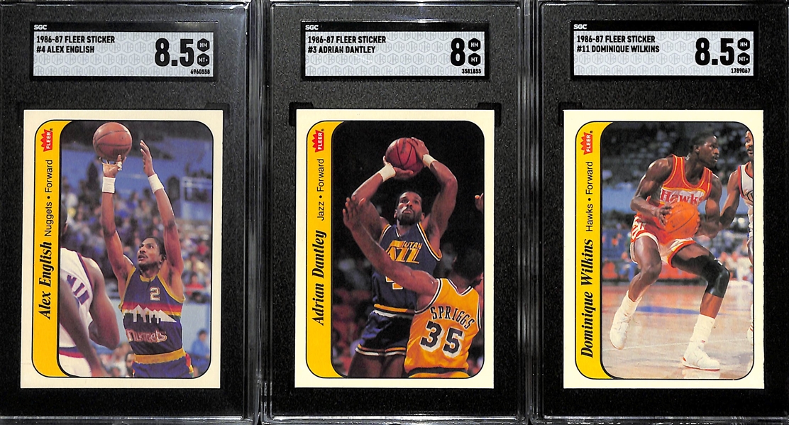 (7) 1986-87 Fleer Basketball Stickers inc. Olajuwon, Abdul-Jabbar & 3 Graded (Alex English SGC 8.5, Adrian Dantley SGC 8, Dominique Wilkins SGC 8.5) - Inc. Duplicates of Dantley & English.