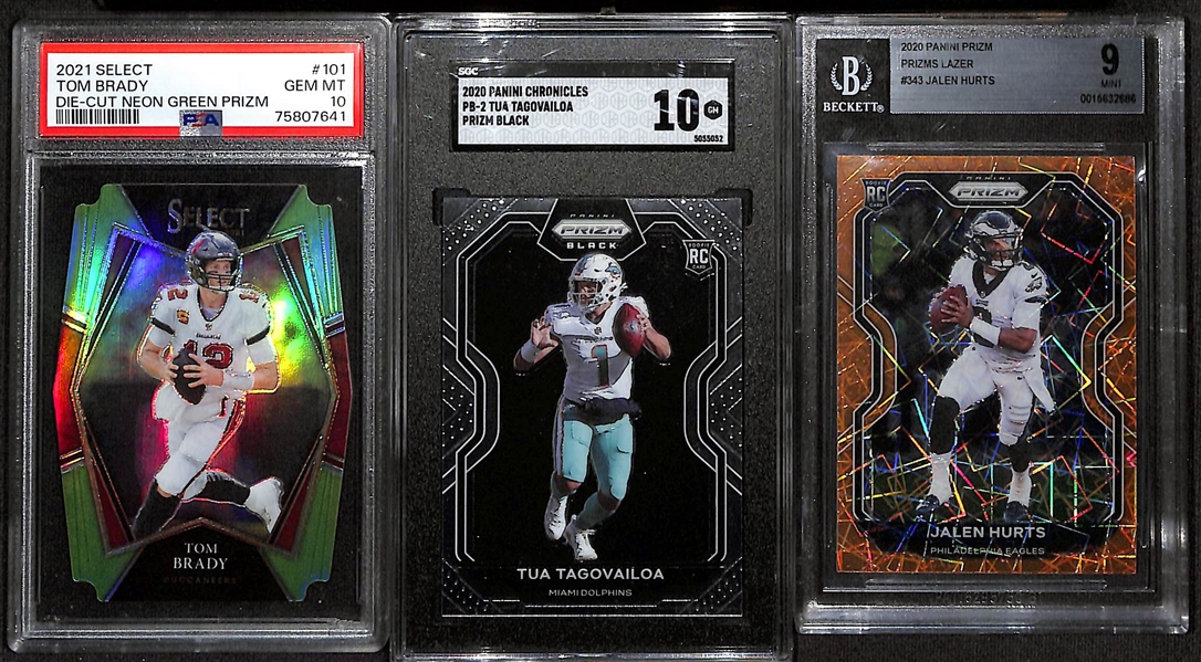 Lot of (3) Graded Quarterback Cards - 2020 Prizm Jalen Hurts Orange Lazer Rookie (BGS 9), 2021 Select Tom Brady Neon Green Die Cut (PSA 10) (#/349), 2020 Chronicles Prizm Black Tua Tagovailoa...