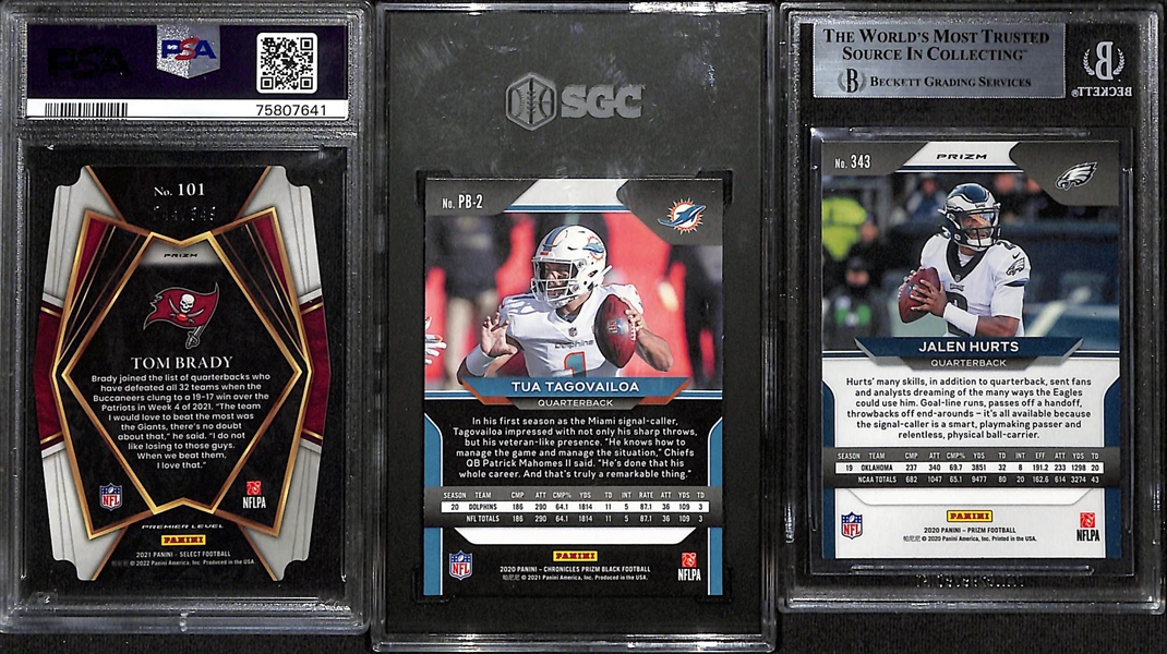 Lot of (3) Graded Quarterback Cards - 2020 Prizm Jalen Hurts Orange Lazer Rookie (BGS 9), 2021 Select Tom Brady Neon Green Die Cut (PSA 10) (#/349), 2020 Chronicles Prizm Black Tua Tagovailoa...