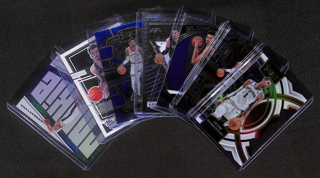 Lot of (7) 2023-24 Victor Wembanyama Rookie Cards- Select White Die Cut (#/149), Select, Prizm Global Reach, Recon, Select Retail, Donruss The Rookies, Recon Rookie