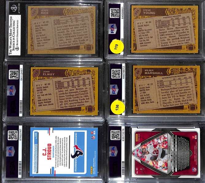 (6) Graded Football Cards w. 1986 Topps Jerry Rice Rookie (BGS 8), Steve Young (PSA 7), John Elway (PSA 8), Wilbur Marshall (PSA 8).  Also Includes 2023 Donruss CJ Stroud (PSA 9) & 2020 Spectra Tom...