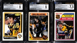 (3) Signed Mario Lemieux Cards (CGC/JSA Slabbed) - 1985-86 OPC Rookie Scoring Leader #262 (CGC/JSA 7.5, Auto 9), 1986-87 OPC #122 (CGC 6, Auto 8), 1987-88 Topps All-Star Sticker Card #11 (CGC 6, Auto
