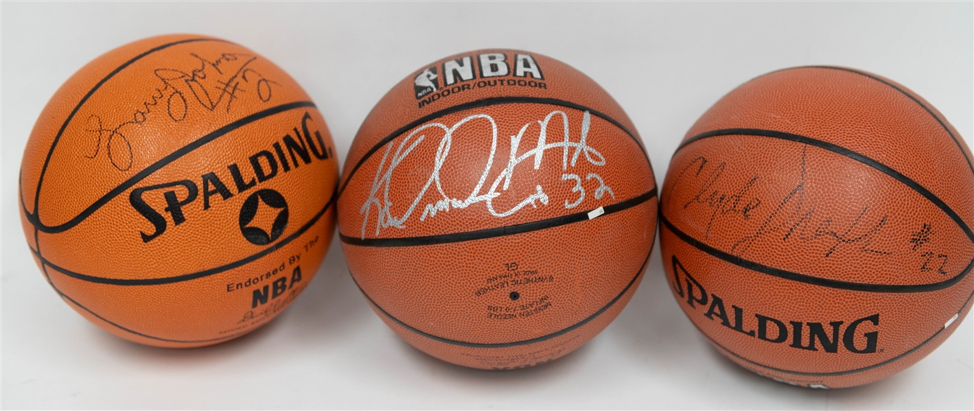 Signed Basketball Lot - Karl Malone, Clyde Drexler, & Larry Johnson Signed Spalding Official Basketballs (Includes JSA Auction Letter)
