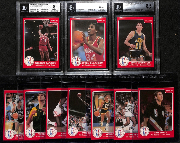 Lot of (10) 1985-86 Star All Rookie Team Cards - Charles Barkley (BGS 8), Hakeem Olajuwon (BGS 8.5), John Stockton (BGS 8.5), Sam Bowie, Sam Perkins, Vern Fleming, Otis Thorpe, Kevin Willis, Tim...