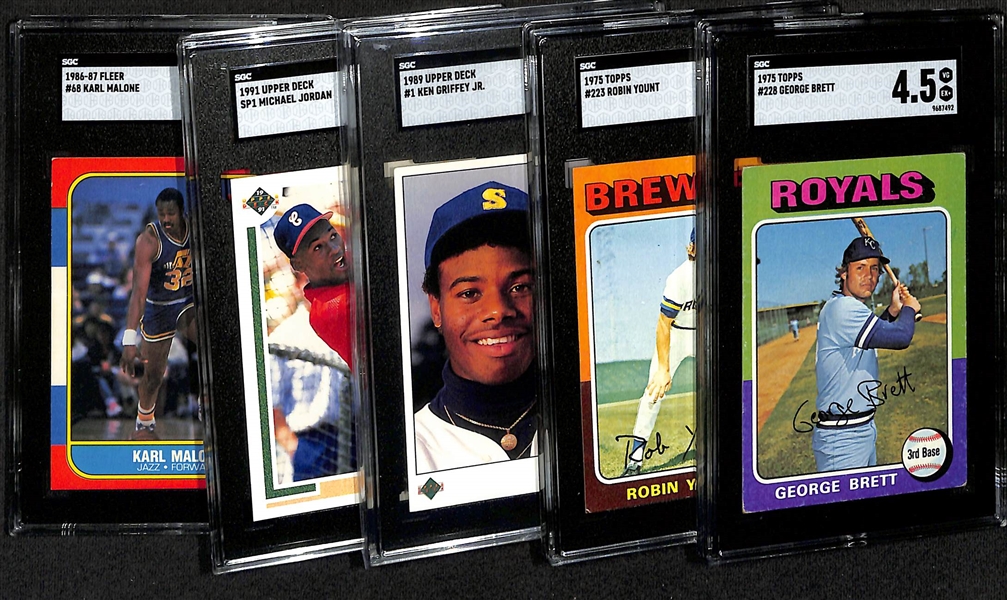 Lot of (5) SGC Graded Rookie Cards w. 1975 George Brett (SGC 4.5), 1975 Yount (SGC 5), 1989 UD Ken Griffey Jr., 1991 Michael Jordan Baseball (SGC 8), 1986 Fleer Karl Malone (SGC 4)