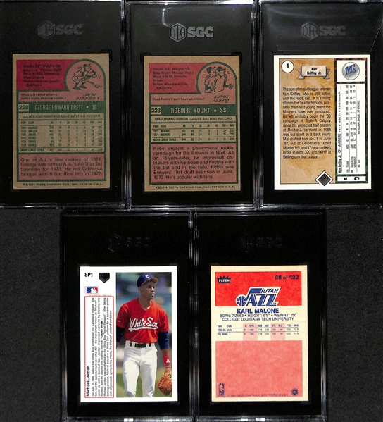 Lot of (5) SGC Graded Rookie Cards w. 1975 George Brett (SGC 4.5), 1975 Yount (SGC 5), 1989 UD Ken Griffey Jr., 1991 Michael Jordan Baseball (SGC 8), 1986 Fleer Karl Malone (SGC 4)