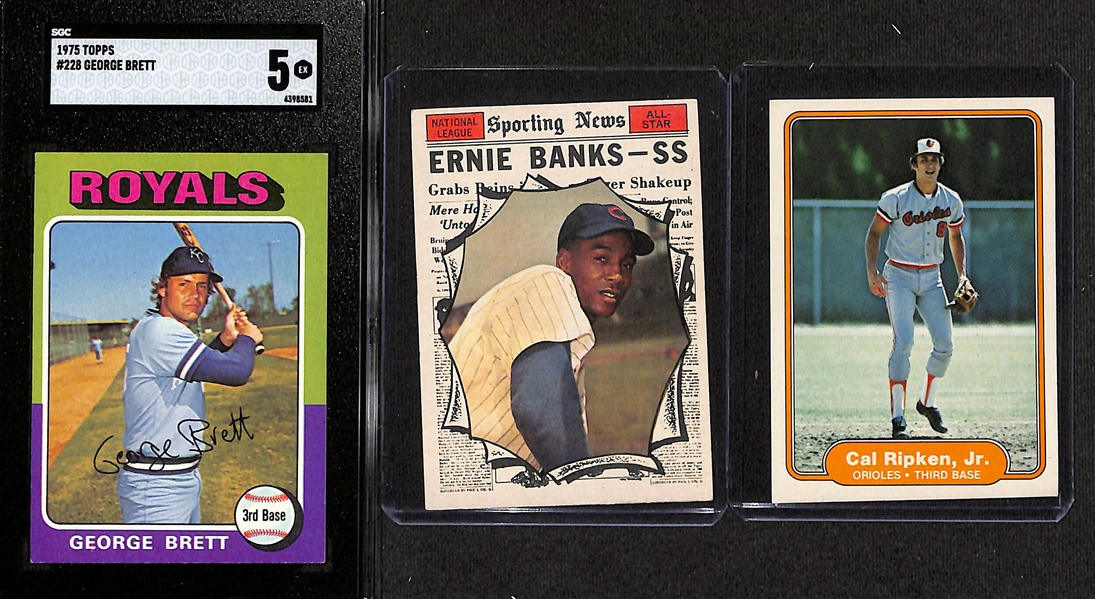 Baseball Card Lot - 1975 Topps George Brett Rookie (SGC 5), Topps 1961 Ernie Banks All-Star, 1982 Fleer Cal Ripken Jr. Rookie Card