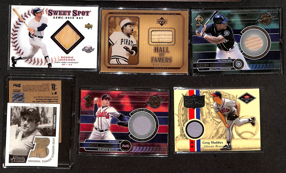 (35) Baseball Jersey/Bat Relic Cards w. Yogi Berra, Stargell, R. Henderson, M. Schmidt, R. Jackson, (2) G. Maddux, +